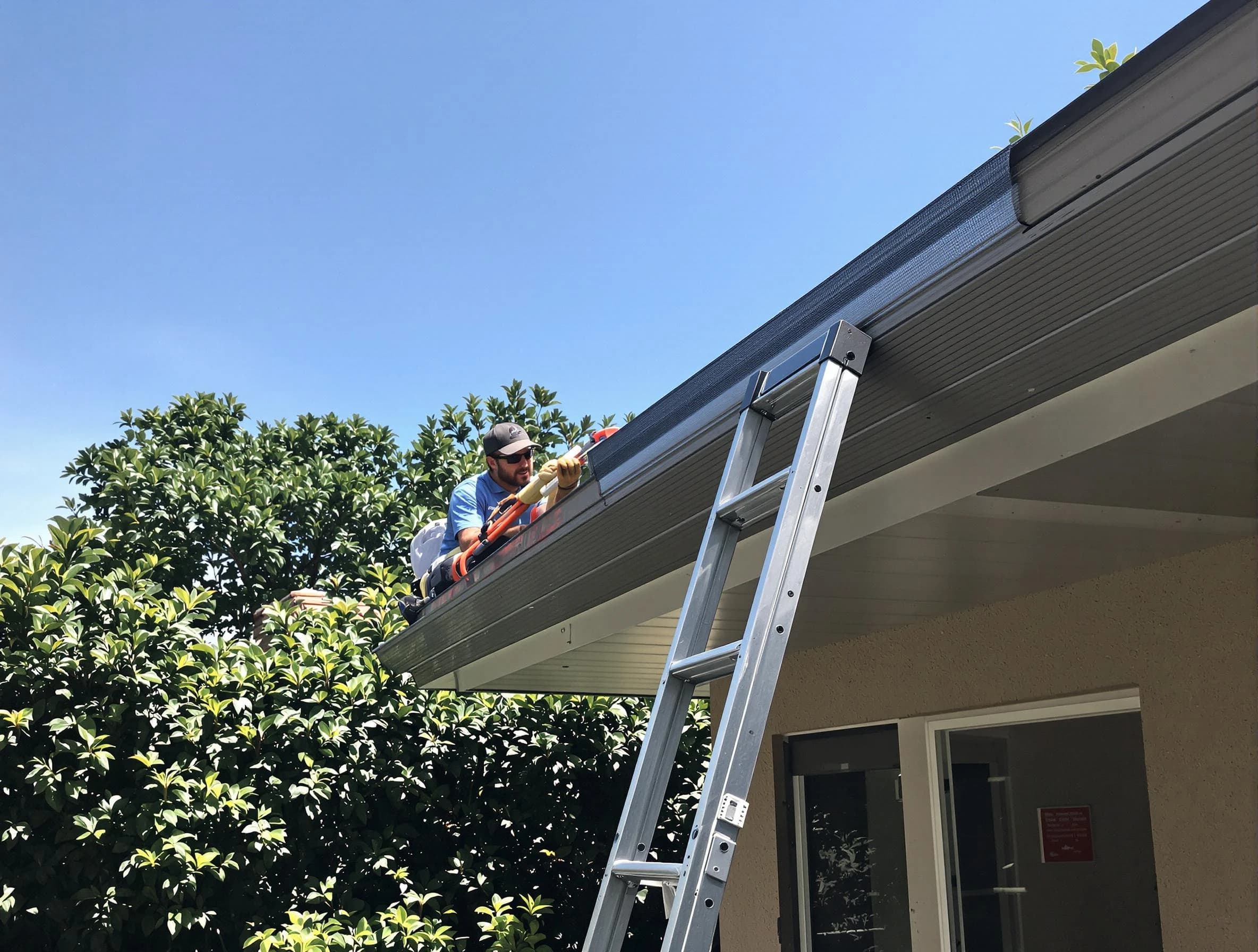 Kent Roofing Company installing gutter guards for a homeowner in Kent, OH