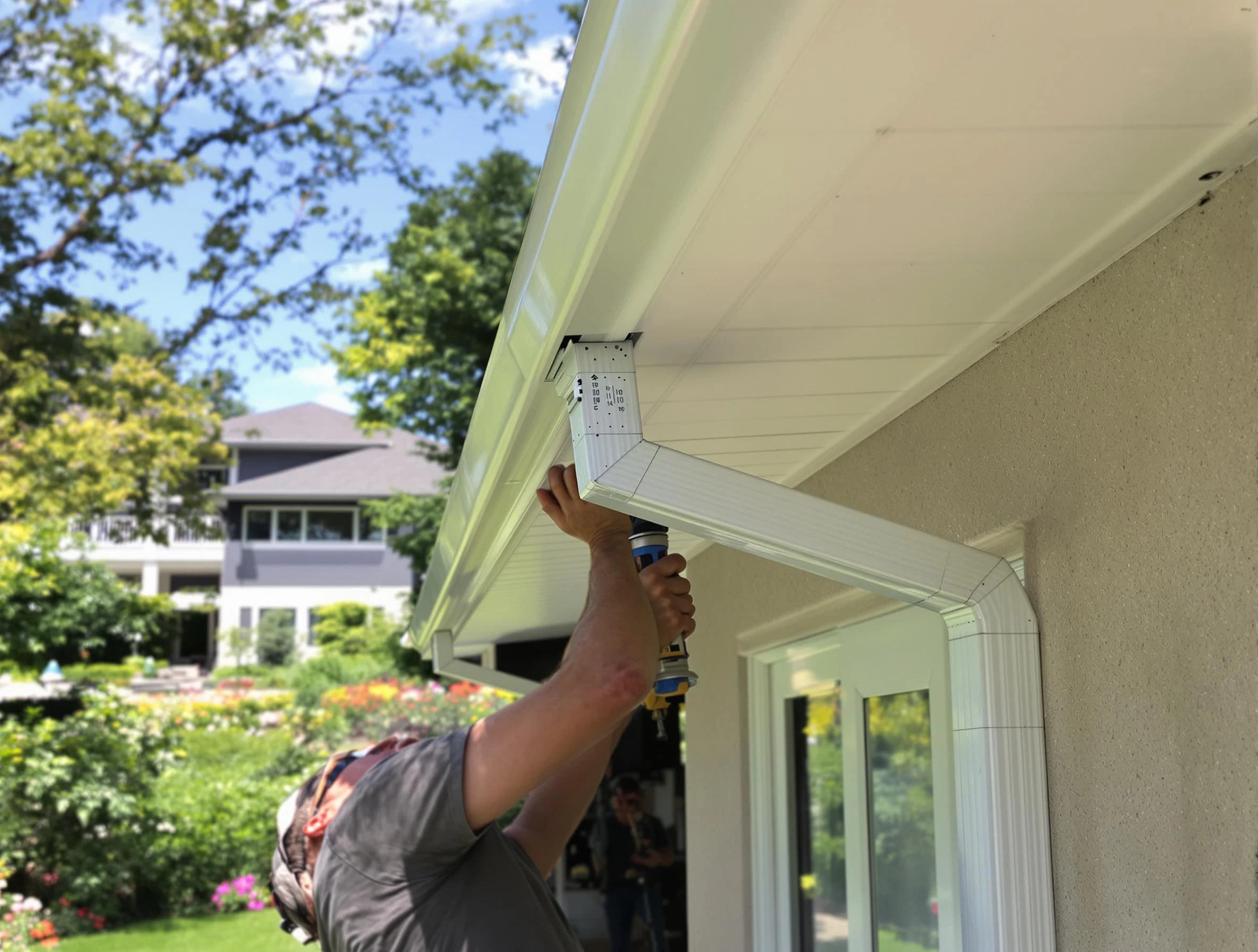 Kent Roofing Company technicians performing gutter installation in Kent, OH