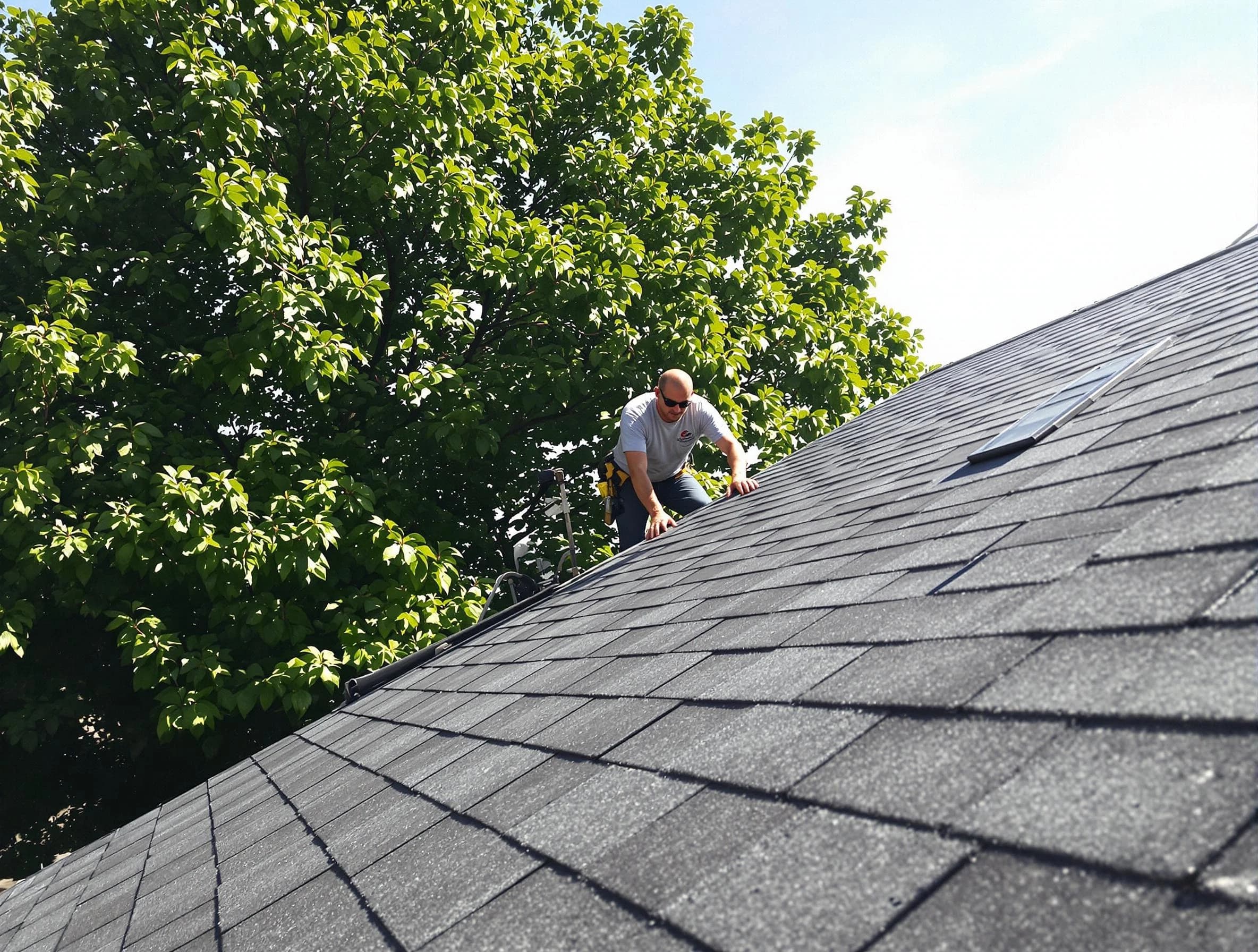 Certified roofers from Kent Roofing Company working in Kent, OH